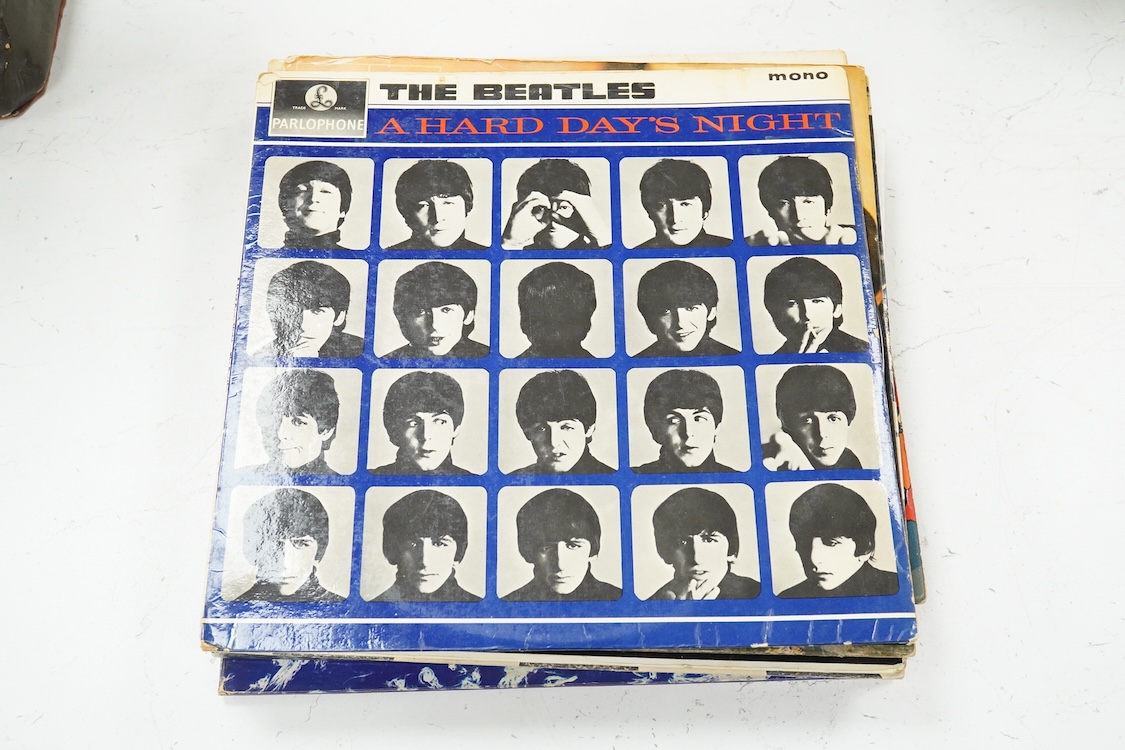 Eleven LP record albums including nine The Beatles and related albums; Beatles For Sale, Hey Jude, Yellow Submarine, All Things Must Pass, etc., together with the Rolling Stones; Their Satanic Majesties Request, and Pink